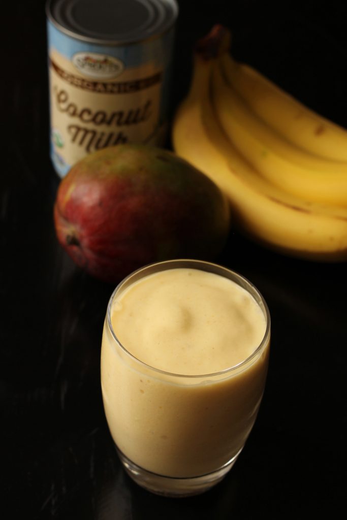 bananas and mango on table by Smoothie