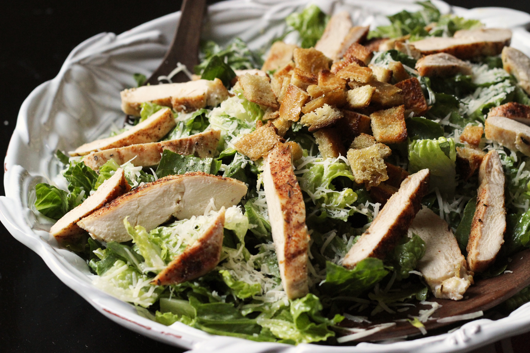 large bowl of chicken caesar salad