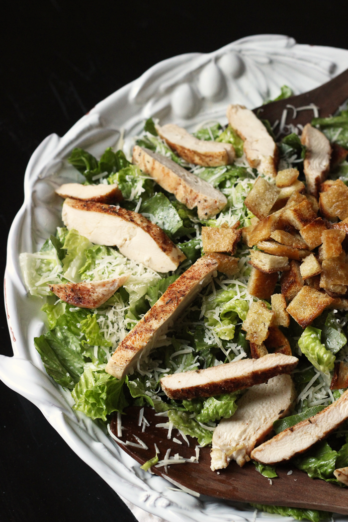 A bowl of chicken caesar salad