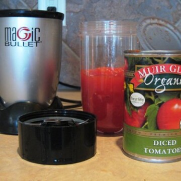 can of tomatoes on counter with magic bullet