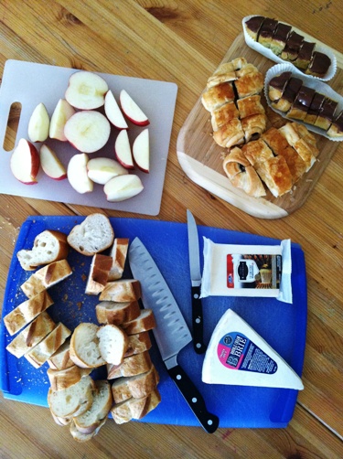 platters of apples, bread, and cheese