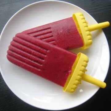 plum popsicles on a plate