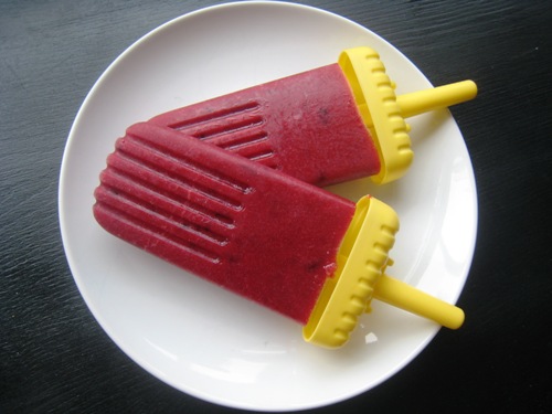 plum popsicles on a plate