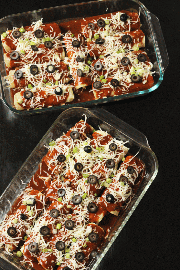 two pans of chicken and chile enchiladas