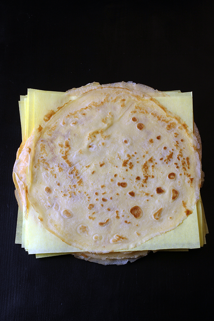 crepes stacked with papers for freezing