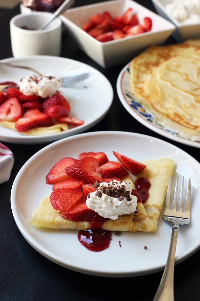 dessert crepes with strawberries cream and chocolate