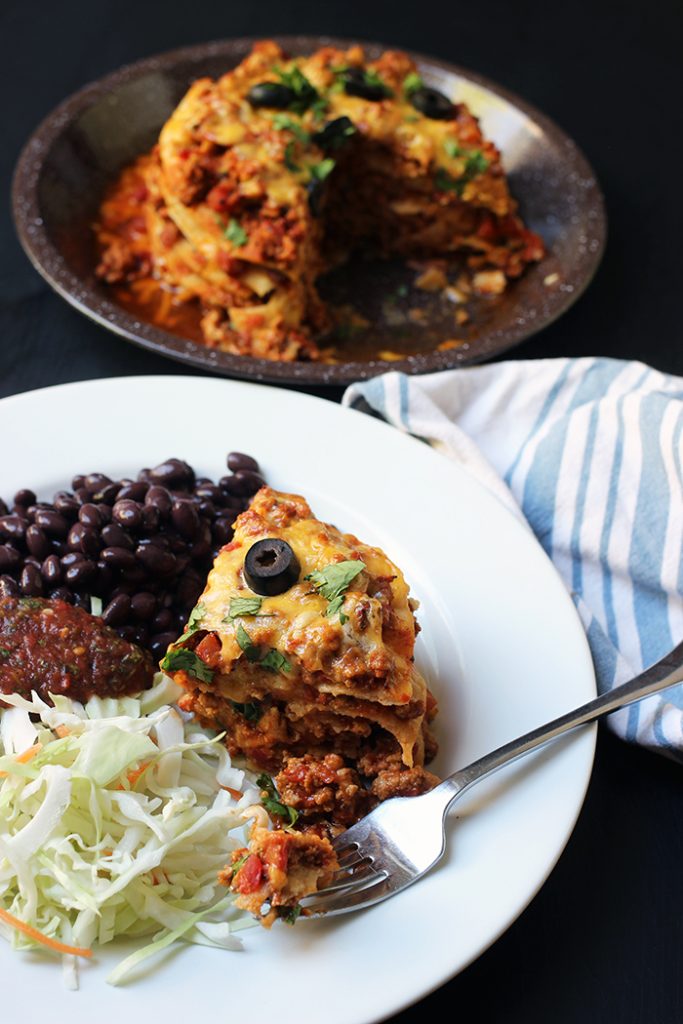 dinner plate with serving platter of chili stacks