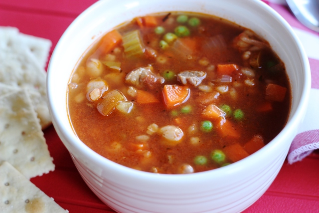 A close up of a bowl of beef soup
