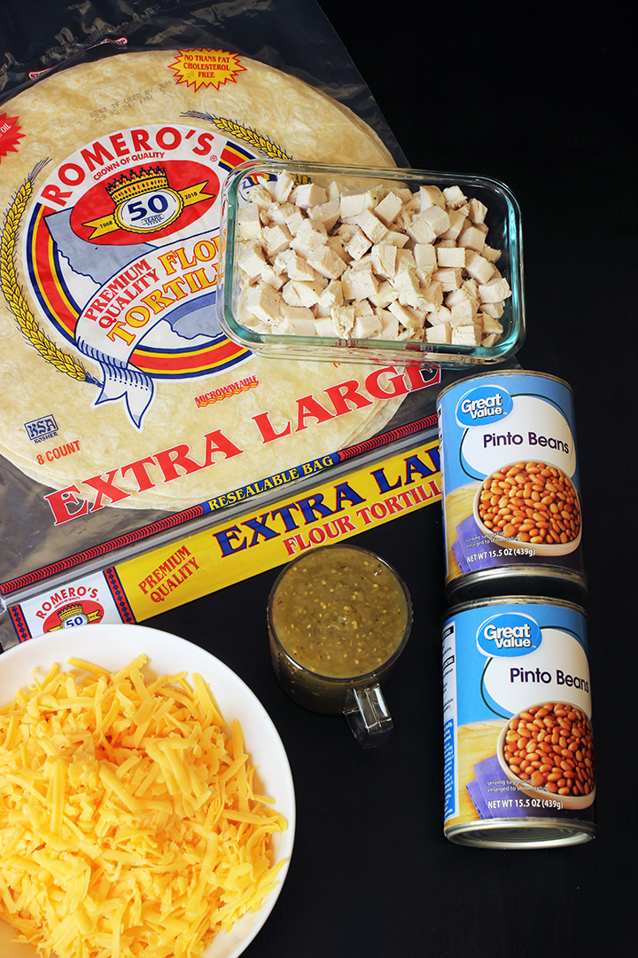 burrito ingredients laid on black table