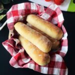 white whole wheat sub rolls in basket