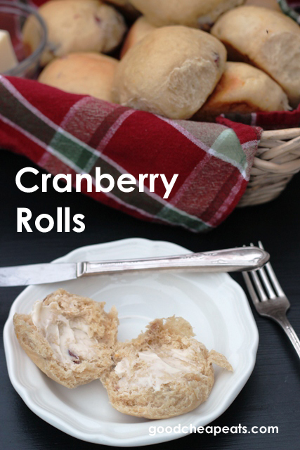 Whole Wheat Cranberry Roll on plate with butter