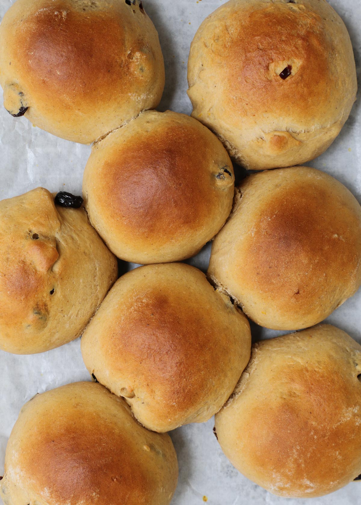 baked rolls cooling on a rack.