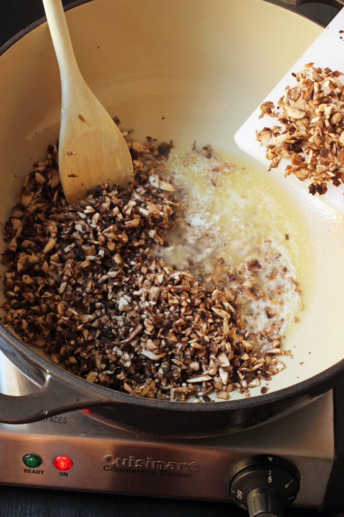 sauteing mushrooms in a dutch oven