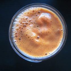 overhead shot of carrot apple juice with ginger