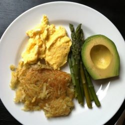 A plate of eggs and sweet potato hash browns