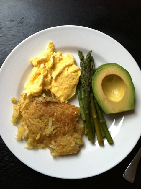 A plate of eggs and sweet potato hash browns