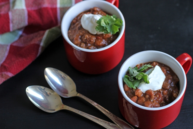 mugs of chili and spoons