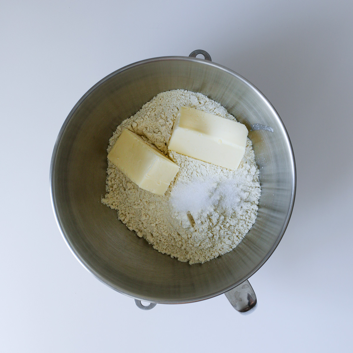 butter, masa, and salt in mixer bowl.