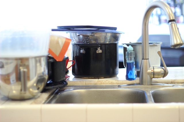 clean dishes on the counter by sink