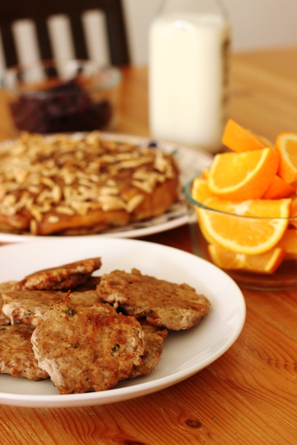 Plate of Homemade Spicy Turkey Sausage, and a bowl of orange slice