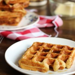 A plate of oatmeal waffles on a table