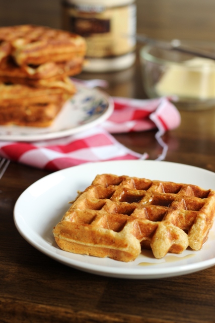 A plate of oatmeal waffles on a table