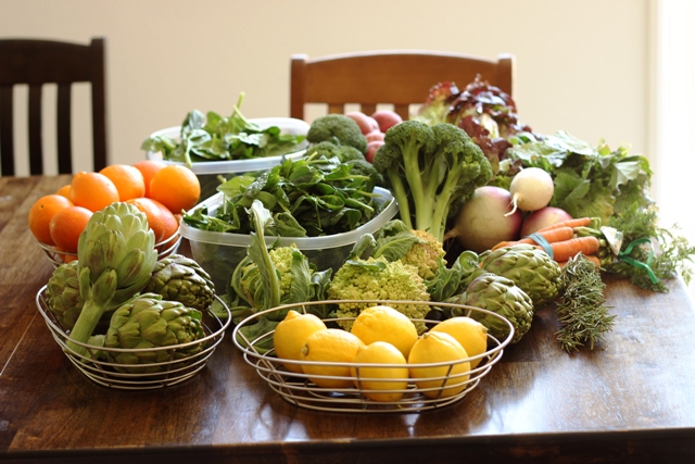 baskets of fruit and vegetables on table