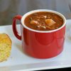 A close up of mug of chili bean soup