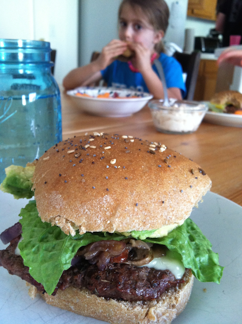 burger on a plate on table