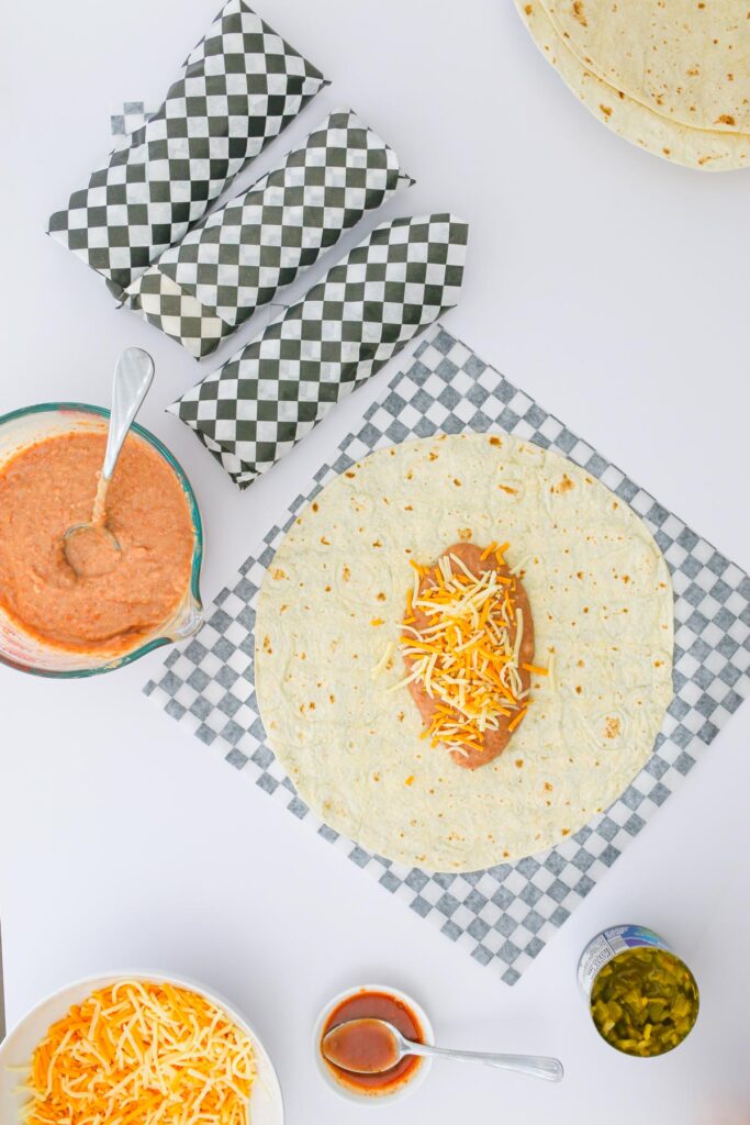 beans and cheese on the tortilla.