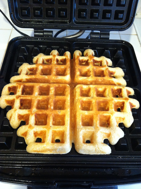 waffles cooking in waffle maker