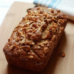 Coconut Cashew Bread on top of a wooden cutting board