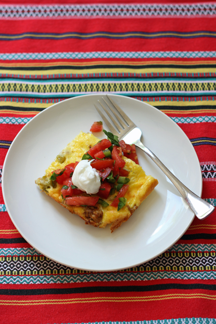 Slice Of Spicy Turkey Egg Bake on a plate with a fork