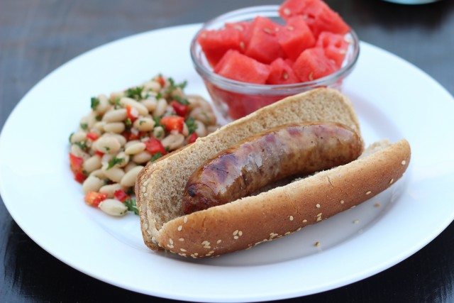 A close up of a Bratwurst on a plate