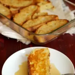 A plate of French toast with syrup