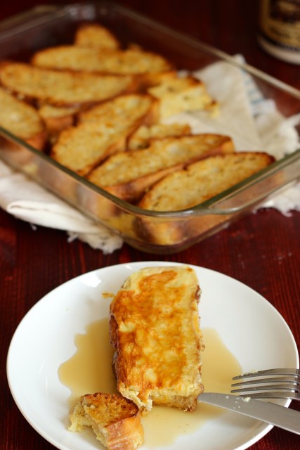 A plate of French toast with syrup