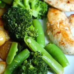 A plate of veggies and chicken