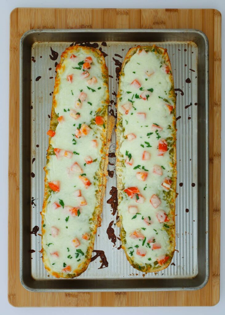 the baked french bread pizza on baking sheet.