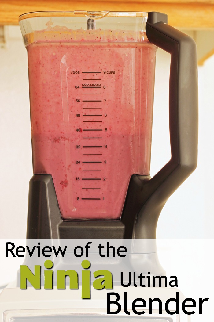 pinnable image of the ninja ultima blender full of pink smoothie