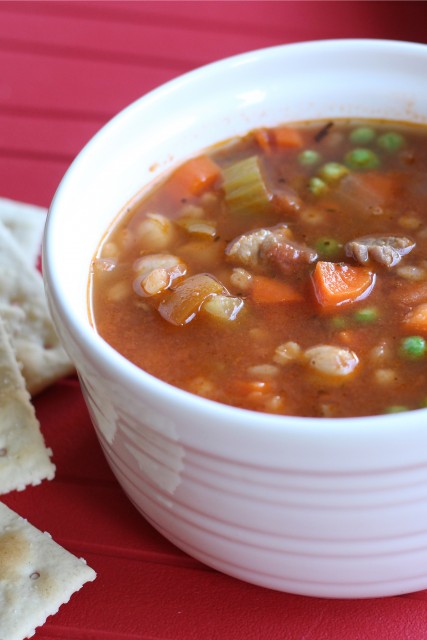 A bowl of soup, with crackers