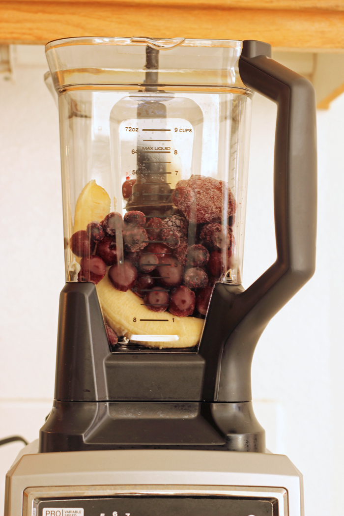 Ninja ultima blender with fruit ready to blend in a smoothie