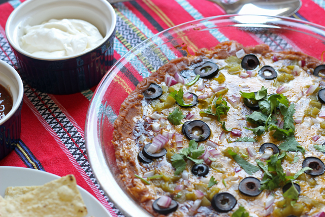 layered nachos in pie plate with chips