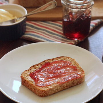 A plate of muffin bread with jam