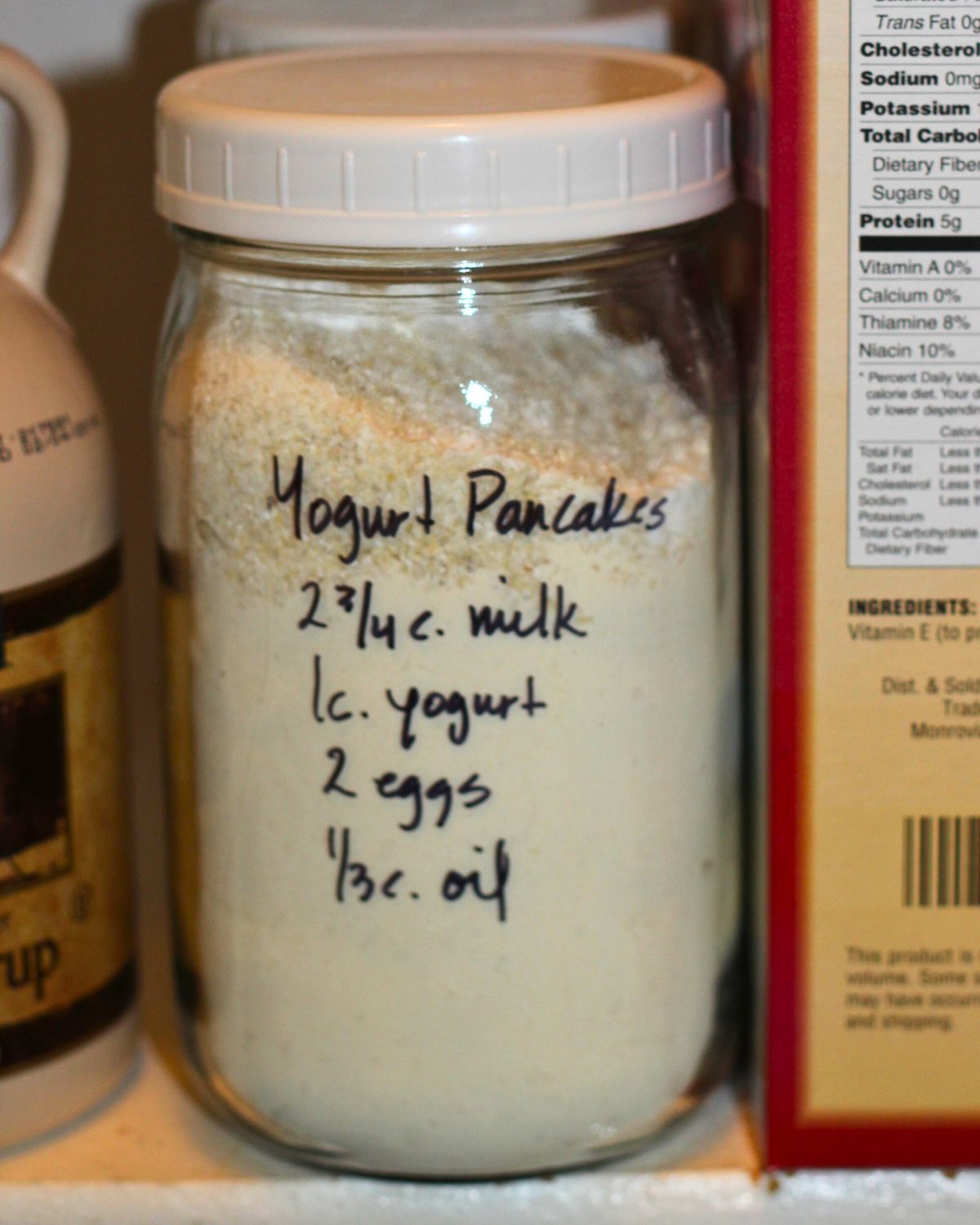 jar of yogurt pancake mix, with wet ingredients to add written on the jar.