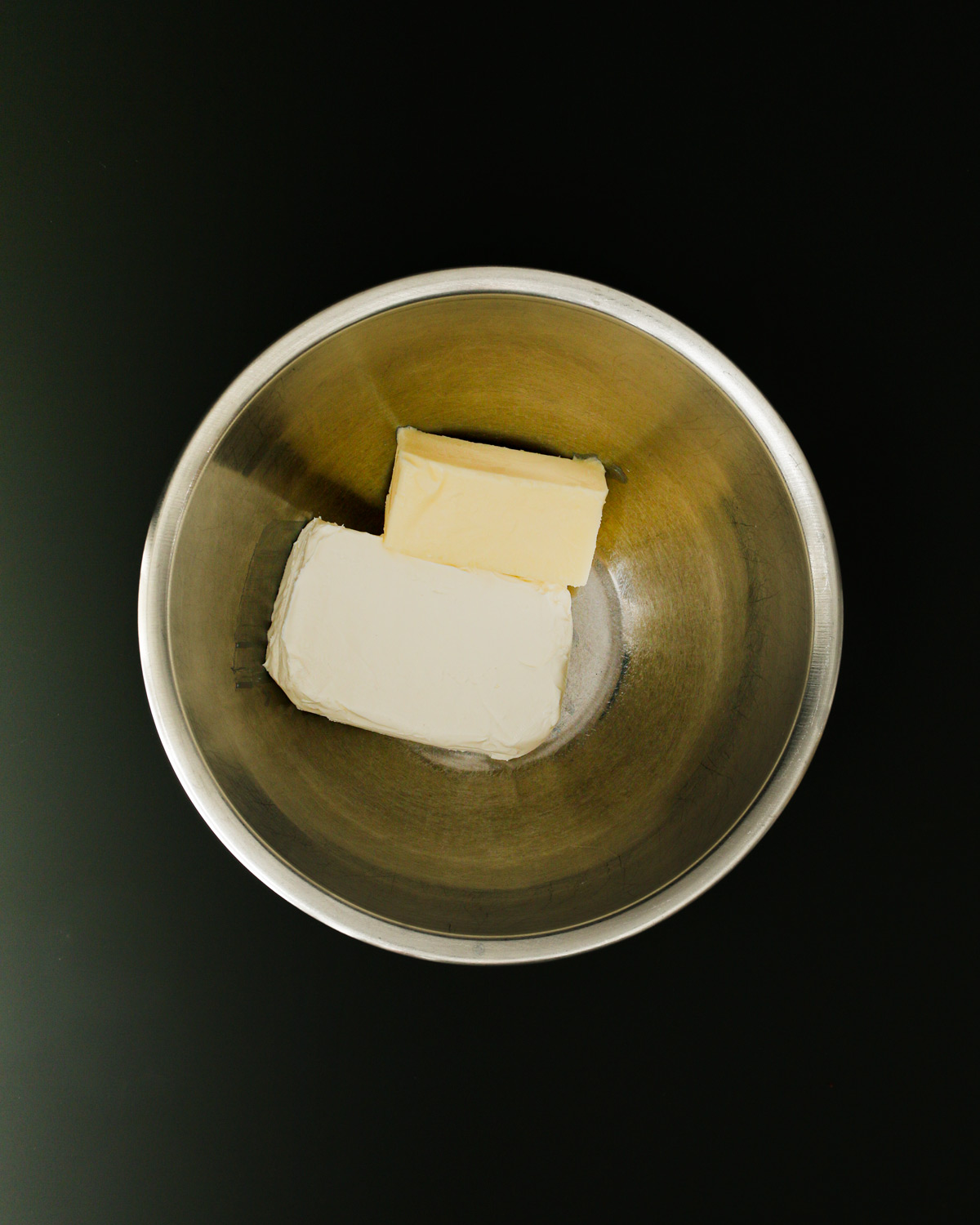 butter and cream cheese in mixing bowl.