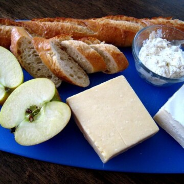 Board on a table, with Baguette and Cheese