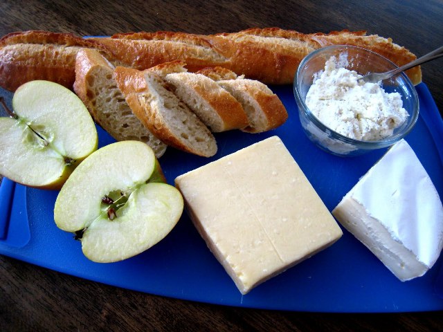 Board on a table, with Baguette and Cheese