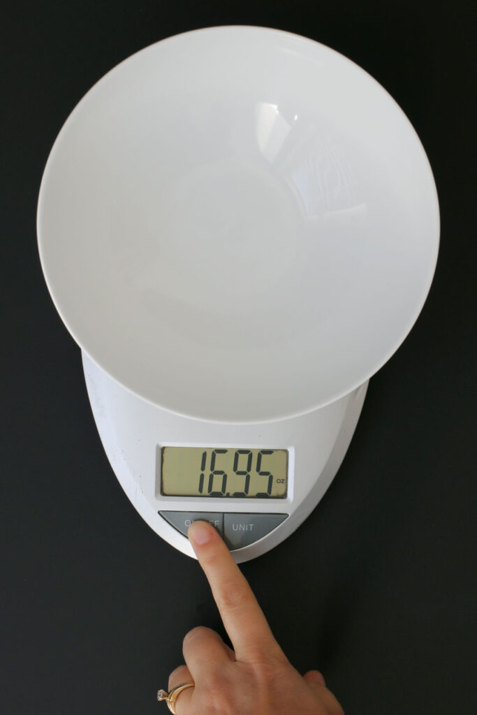 food scale holding empty bowl weighing almost 17 ounces.
