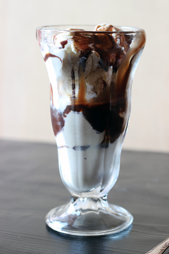 vanilla ice cream sundae with chocolate syrup