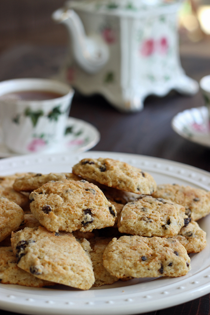 A close up of a plate of scones on a table